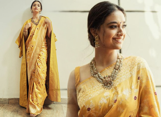Keerthy Suresh's modern avatar in a yellow saree with a coat!